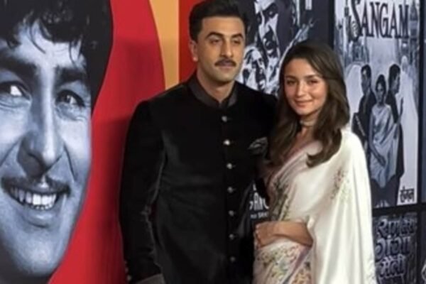 Ranbir Kapoor in black bandhgala moustache, Alia Bhatt in white saree dreamily grace the show at Raj Kapoor Film Festival
